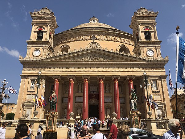 The Basilica of the Assumption of Our Lady, also known as Mosta Dome or as Mosta Rotunda, in Mosta, Malta. The façade is decorated for the Feast of th