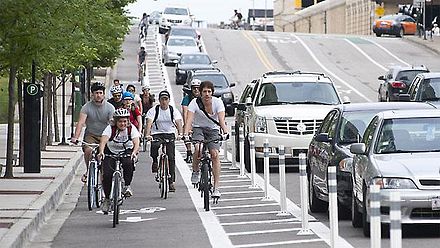 Cyclists commuting on the Kinzie cycle track in Chicago