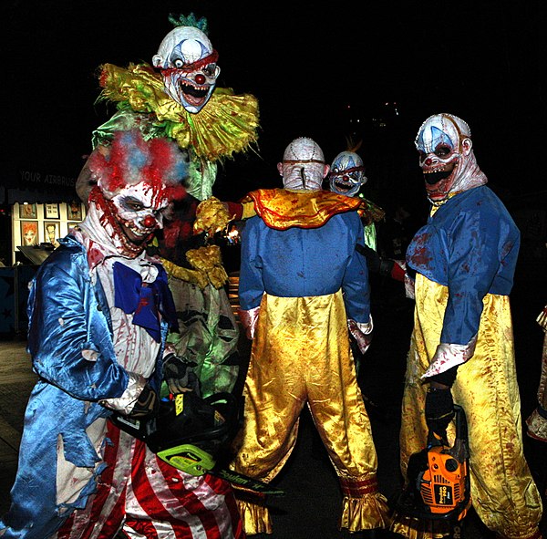 A group of people in evil clown costumes at a PDC 2008 party at Universal Studios