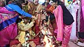 Sindur daan Hindu ritual as the groom is full blind ladies assisting her to complete rituals at Voice Of World Kolkata 40