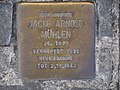"Hier wohnte Jacob Arnold Mühlen, Jg. 1889, verhaftet 1938 Neuengamme, tot 2.11.1942"