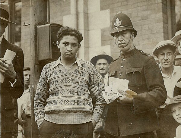 A member of the CPC's Toronto club is arrested for distributing party literature, August 12, 1929.