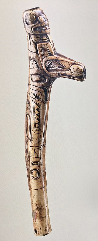 Tsimshian ceremonial club of carved antler bone, circa 1750. The head carved at top of the club may be the first owner of the Wolf crest, carved on the projecting tine. The club may have been used by Tsimshian shamans in religious ceremonials. Tsimshian club circa 1750.jpg