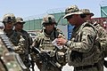U.S. Army Sgt. Jeffery Lesley, right, assigned to the 5th Battalion, 82nd Field Artillery Regiment, 4th Brigade Combat Team, 1st Cavalry Division, prepares to conduct a mission brief at Forward Operating Base 130518-A-XM609-018.jpg