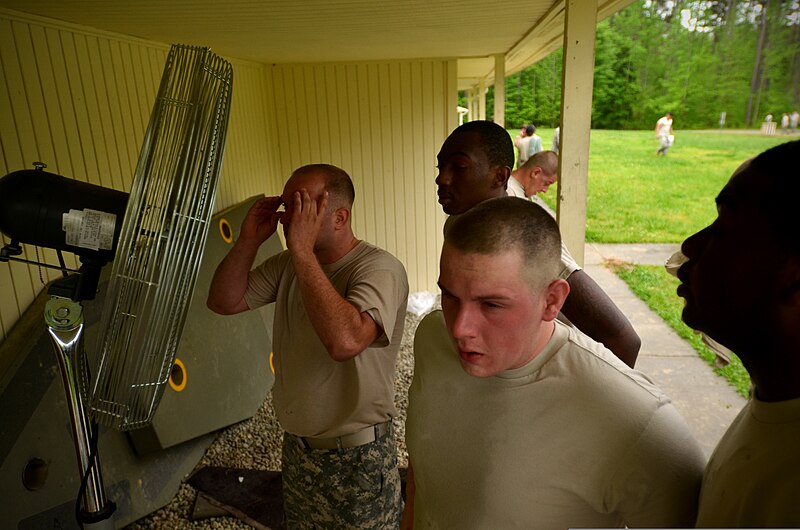 File:U.S. Soldiers with Headquarters and Headquarters Company, 105th Military Police (MP) Battalion and the 1132nd MP Company, North Carolina Army National Guard stand in front of a fan to help reduce the effects of oleoresin capsicum 130501-Z-AY498-025.jpg