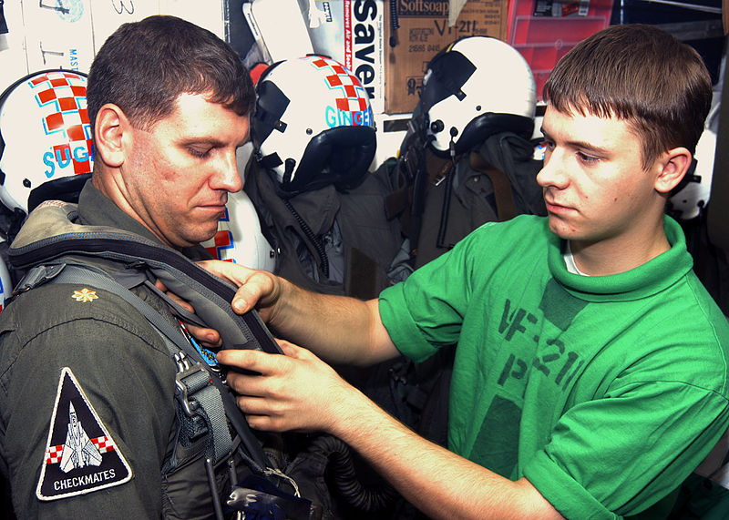 File:US Navy 030930-N-6293B-001 Aircrew Survival Equipmentman Airman Christopher S. Shows, from Mendenhall, Miss., helps Lt. Cmdr. Steven T. Heumanowski.jpg