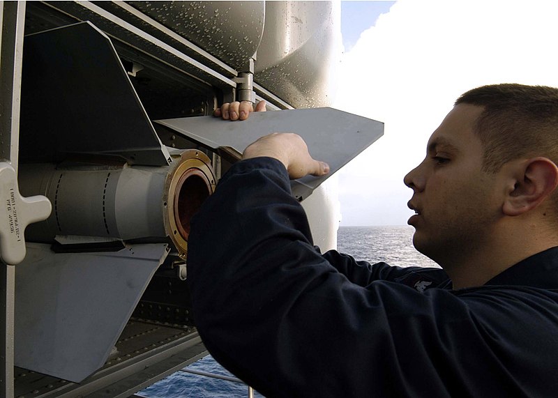 File:US Navy 041031-N-0499M-041 A Fire Controlman attaches the fin to a RIM-7 NATO Sea Sparrow missile.jpg