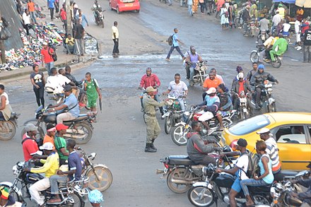 Gendarme regulating traffic in Ndokoti