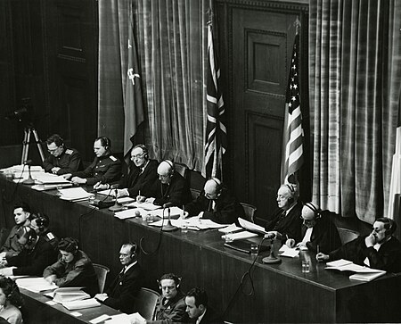 Tập_tin:View_of_judges_panel_during_testimony_Nuremberg_Trials_1945.jpeg