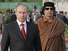 Gaddafi with then-President of Russia Vladimir Putin in 2008 Vladimir Putin with Muammar Gaddafi-2.jpg