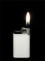 White lighter with flame.JPG