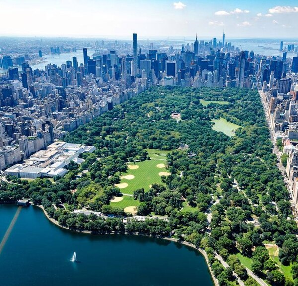 Central Park, one of the world's most visited tourist attractions, is surrounded by the skyscrapers of Manhattan in New York City.