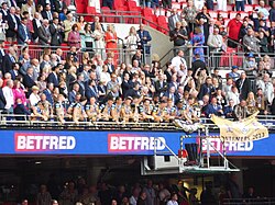 Leigh Leopards players gathered on Wembley's Royal Balcony while John Asiata is handed the Challenge Cup.