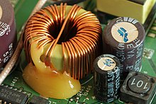 Toroidal inductor in the power supply of a wireless router 3Com OfficeConnect ADSL Wireless 11g Firewall Router 2012-10-28-0869.jpg