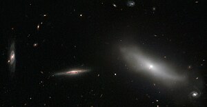 Photo from the Hubble Space Telescope: NGC 1190 is on the right, the other galaxies are background objects.