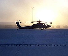 An AH-64A Apache from 1st Battalion, 501st Aviation Regiment, 1st Armored Division at the Baghdad International Airport, c. 2004 Apache-on-the-flight-line.jpg