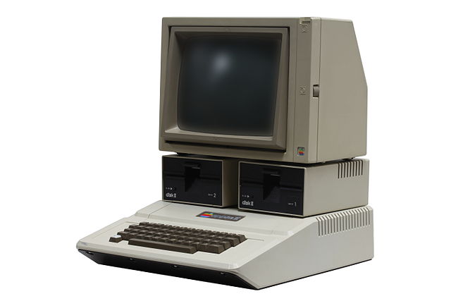 The 1977 Apple II, shown here with two Disk II floppy disk drives and a 1980s-era Apple Monitor II