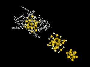 Structure of Au25R18-,(R=SCH2Ph, white: H, grey: C, dull yellow :S, yellow: Au) single crystal X-ray diffractometry. Top left: full structure ; middle : only gold core and Au-S shell displayed, bottom right: only Au13-core displayed Au25R18 minus STRUCTURE CORESHELL CORE.png