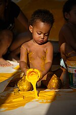 Baby playing with yellow paint. by Peter Klashorst Baby playing with yellow paint. Work by Dutch artist Peter Klashorst entitled "Experimental".jpg