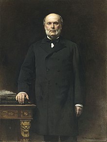 Peinture représentant Jules Grévy, debout, vêtu d'un austère costume noir. Sa main gauche repose sur deux épais livres, posés sur une table.