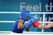 Deutsch: Boxen bei den Olympischen Jugendspielen 2018 Tag 12, 18. Oktober 2018 - Finale Leichtgewicht Mädchen – Junioren-Weltmeisterin und dreifache Juniorinnen-Europameisterin Caroline Sara DuBois (Großbritannien, blau) schlägt Juniorinnen-Asienmeisterin Porntip Buapa (Thailand, rot). English: Boxing at the 2018 Summer Youth Olympics on 18 October 2018 – Girls' lightweight Gold Medal Bout – Caroline Sara DuBois (Grat Britain, blue) wins over Porntip Buapa (Thailand, red). Español: Boxeo en los Juegos Olímpicos Juveniles de Verano de 2018 en 18 de octubre de 2018 - Combate de medalla de oro de peso ligero para niñas - Caroline Sara DuBois (Gran Bretaña, azul ) gana sobre Porntip Buapa (Tailandia, rojo).