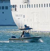 Brevard County Sheriff's boat next to Carnival Victory at Port Canaveral