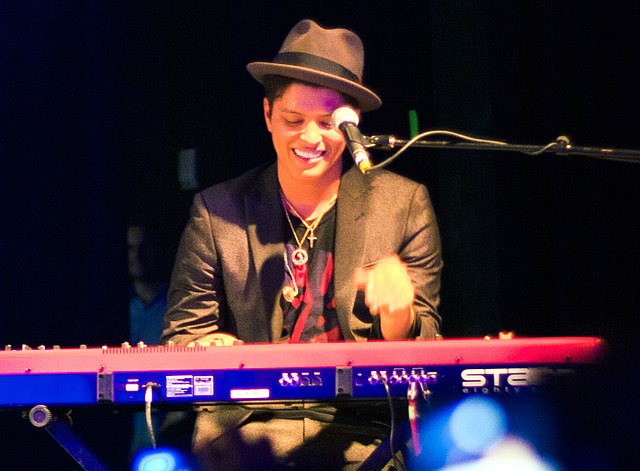 Bruno Mars playing the keyboard in a concert in Houston, Texas, in 2010