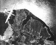 Cape Gloucester New Guinea airdrome as a Liberator saw it during pre-invasion bombing, December 1943 Cape Gloucester airdrome during pre-invasion bombing.jpg