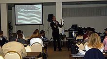 Commander Eric Kaniut, commanding officer of Navy Recruiting District Jacksonville welcomes Delayed Entry Program Sailors to the Family Day Expo. Photo by PH3(AW) Elizabeth Williams Commander Eric Kaniut welcomes Delayed Entry Program Sailors.jpg