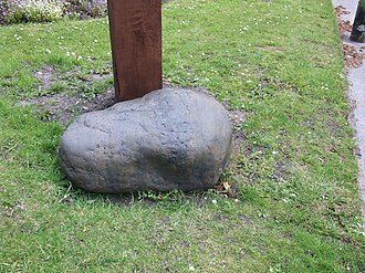 The Touch Stone, a glacial erratic deposited during the last ice age, is where deals were made in the Market Place. Compstall Touchstone 0243.JPG