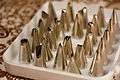 An assortment of metal piping tips