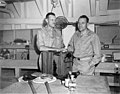 Dr Frederick Hase Rodenbaugh, Sr and Dr Lauren R Donaldson unpacking supplies, probably on board the USS CHILTON, summer 1947 (DONALDSON 23).jpeg