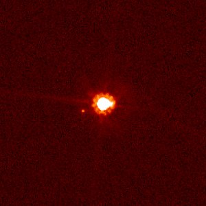 Eris and her moon Dysnomia, photographed by the Hubble Space Telescope