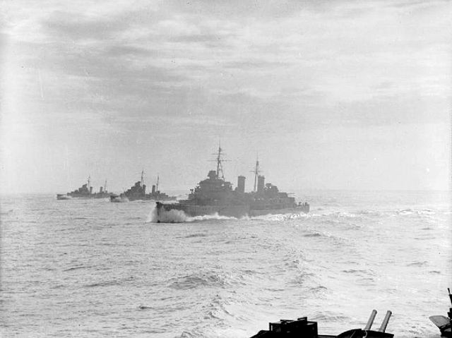 The cruisers Edinburgh, Hermione, and Euryalus, steaming in line abreast whilst they escort a convoy (not visible) as part of Operation Halberd to res