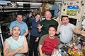ISS-48 Crew members in the Zvezda service module sharing a light moment and a meal.jpg