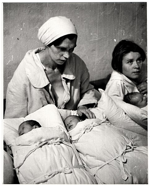 Polish mothers with their newborn infants in a makeshift maternity ward inside a hospital basement during the Bombing of Warsaw by the German Luftwaff