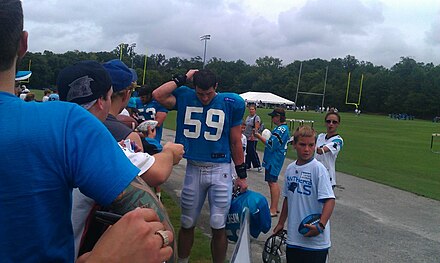 Kuechly signing autographs at Panthers training camp