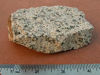 Monzonite Igneous intrusive rock with low quartz and equal plagioclase and alkali feldspar