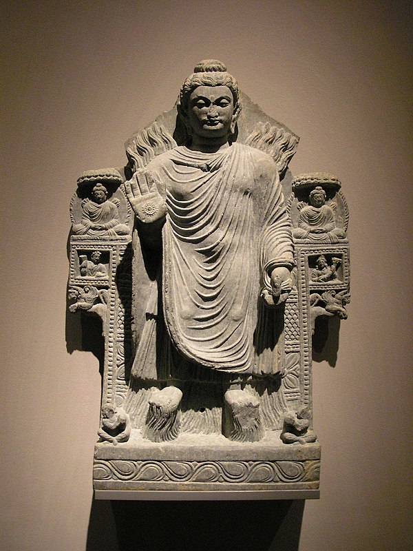 Shakyamuni Buddha demonstrating control over the fire and water elements. Gandhara, 3rd century CE.