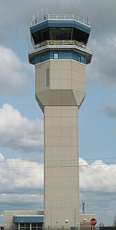 Control tower in 2009 decorated with banner proclaiming "World's Busiest Control Tower" Oshkosh Tower.jpg