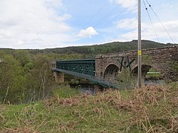 Invershin Viaduct over the Kyle of Sutherland; the public footpath across the Kyle can be seen immediately adjacent to the viaduct. Oykel Viaduct over the Kyle of Sutherland - geograph.org.uk - 2967014.jpg