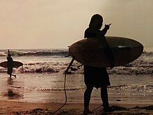 Surfers at Crystal Pier in Pacific Beach, California.