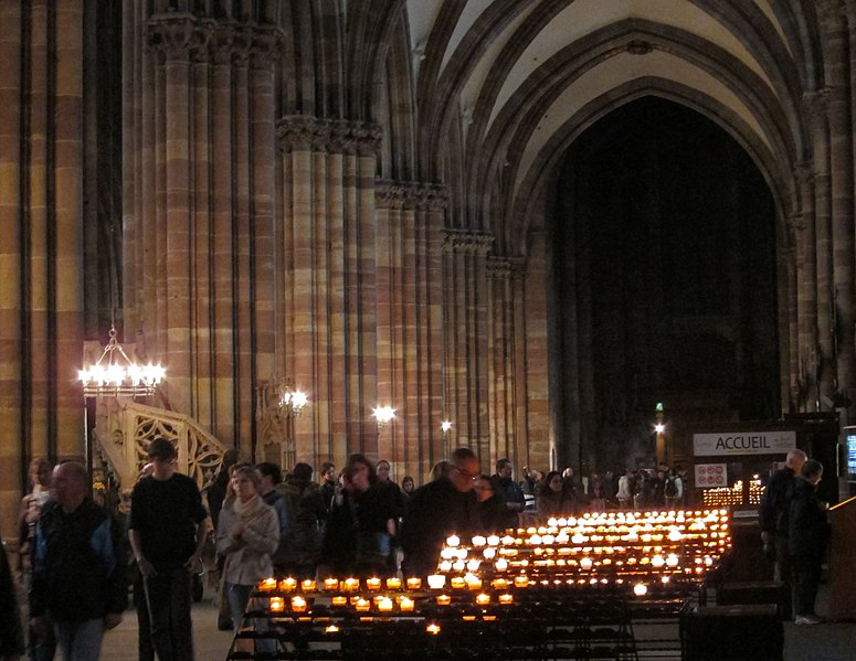 File:Pillars, people and candles.jpg