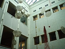 Northern light well, with hanging art exhibit, 2008 Portland City Hall light well.JPG