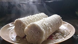 Puttu South Indian breakfast dish of steamed ground rice and coconut shavings