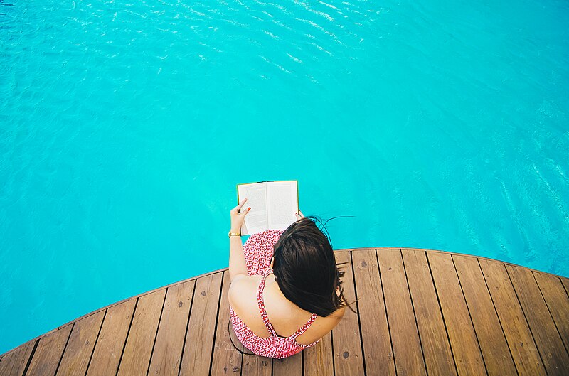 File:Reading at the poolside (Unsplash).jpg