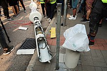 Surveillance lamppost brought down in Hong Kong by citizens fearing state surveillance Sheung Yuet Road lamppost after protesters destroy 20190824.jpg