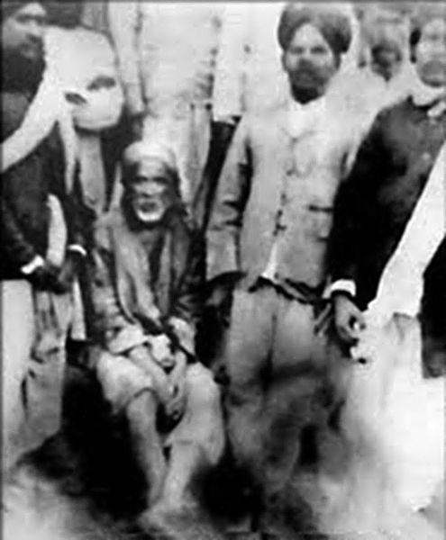 File:Shirdi Sai Baba and devotees.jpg