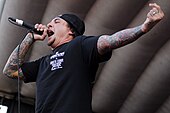 Sonny Sandoval of P.O.D. at Uproar Festival 2012. Over the course of their career, the band has received three Grammy Award nominations. Sonny Sandoval of POD performing.jpg