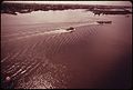 THE MOUTH OF ARTHUR KILL, THE WATERWAY WHICH SEPARATES NEW JERSEY AND STATEN ISLAND. IT IS THE SITE OF A HUGE... - NARA - 551991.jpg